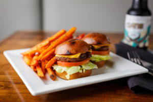 sliders fries on plate with beer on table