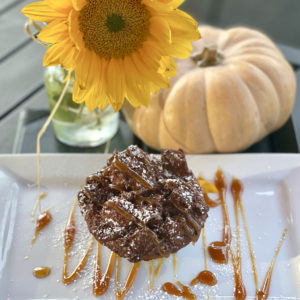 DESSERT ON PLATE WITH FLOWER AND PUMPKIN